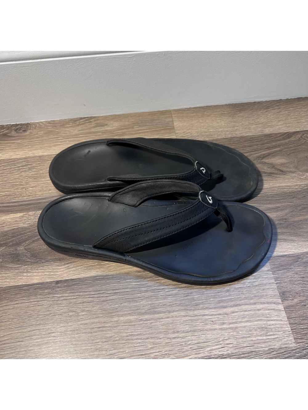 OluKai black flip flops, women's size 9